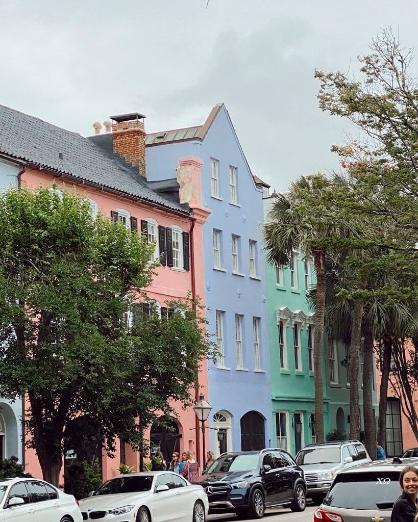 view of pastel pink purple and blue homes on rainbow row charleston